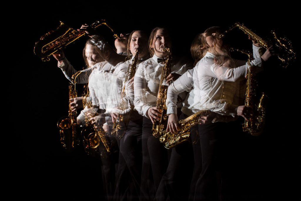High school senior girl playing a saxophone in multiple places