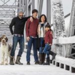 Lee-Lewis Family-8459 family photo on a snowy bridge with their dog