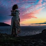 Sereana Green-7547-1200x800 girl standing by the water in regalia
