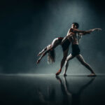 ADT Senior Company-7428-Diana Peck-2 a man and woman doing a dance in a dark setting