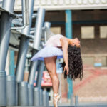 ADT Sr Company 17-18 - 4028 - Loloma Johnston girl in the city bending back in a white ballet tutu