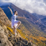Autumn-Vander-Lugt-2652-copy girl on pointe on rocks with mountain in the background
