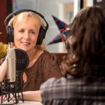 C-Craig-4717-copy headshot of a woman talking on a podcast
