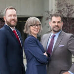 Caltagirone-Lawfirm-8609-copy group of 3 posing for a group headshot