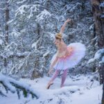 Falyn-Sugar-Plum-1401 a girl dressed in a sugarplum fairy attire in the snowy woods