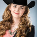 Mariah-0180-copy woman posing for a headshot with a cowboy hat