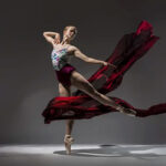 Sammy-Moore-3185-copy girl on point with red fabric floating around her